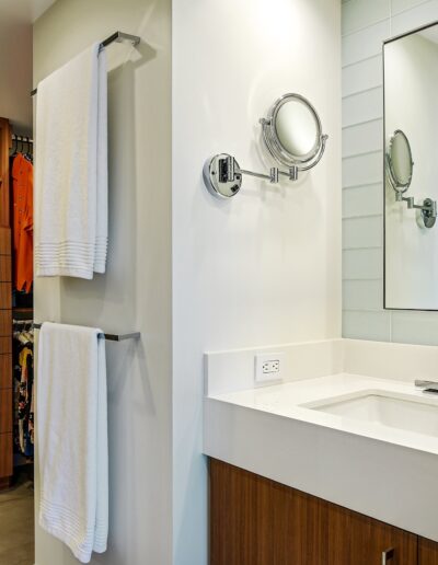 A bathroom with a sink and a mirror.